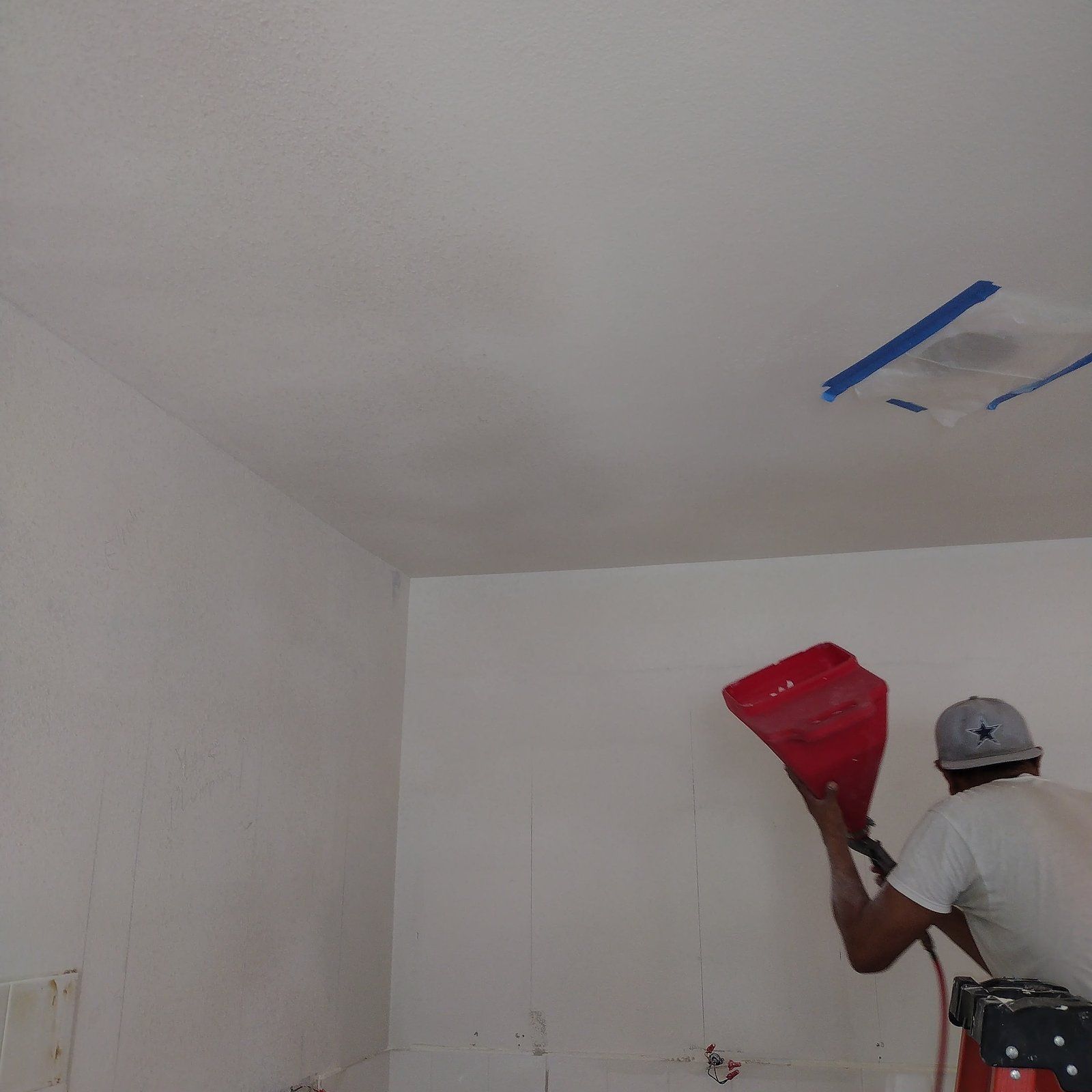 A ceiling being painted