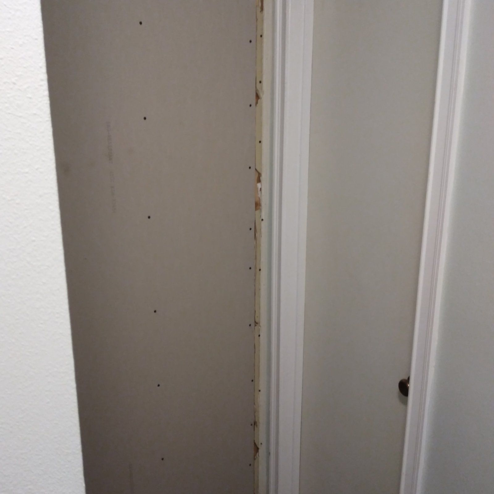 Drywall hung, screws set and seams taped