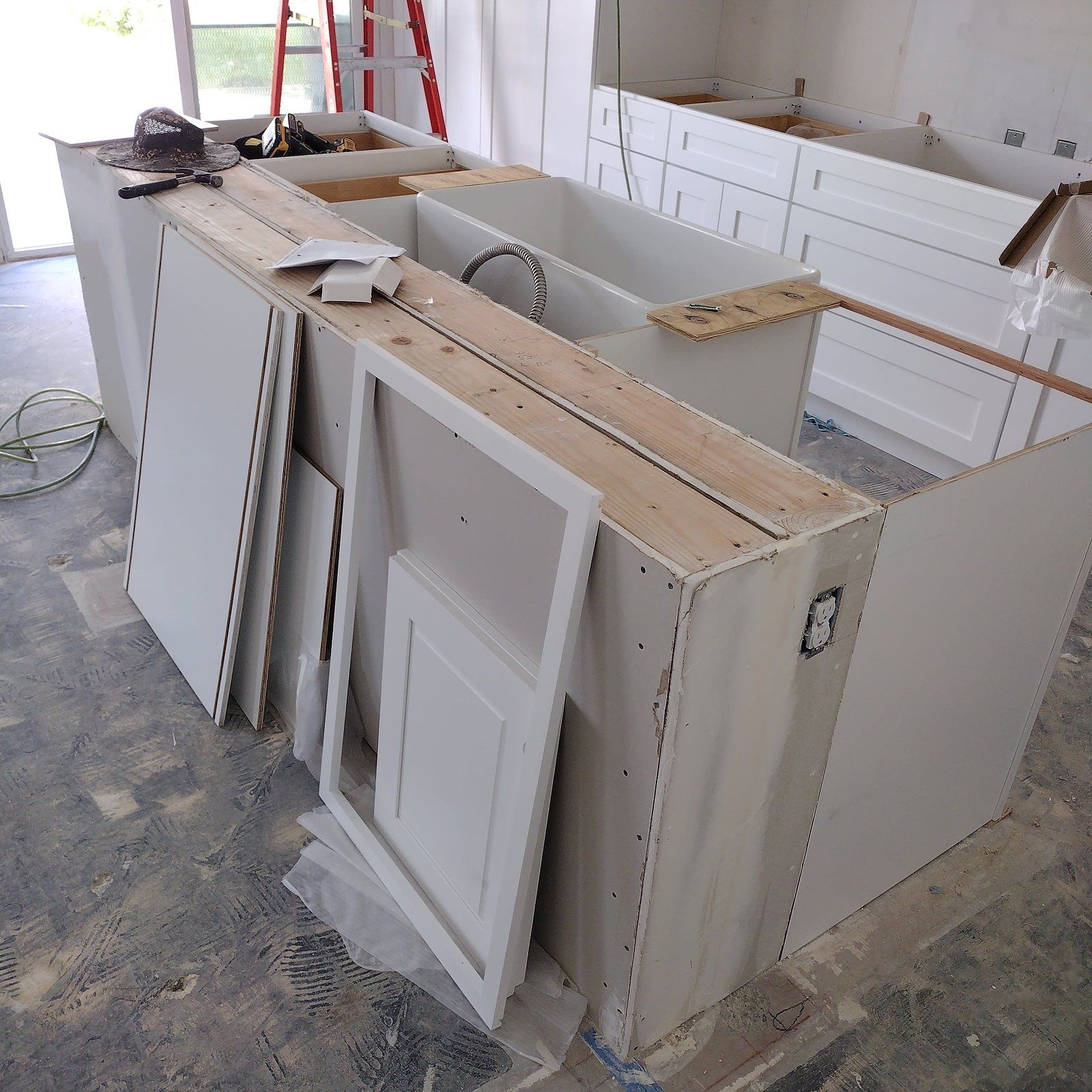Kitchen island being built from plywood and cabinet boxes